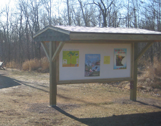 A kiosk features important information in the Bay View School Forest, Proctor.