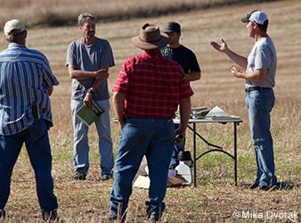 image of farmers talking about conservation efforts in the Chippewa River watershed.